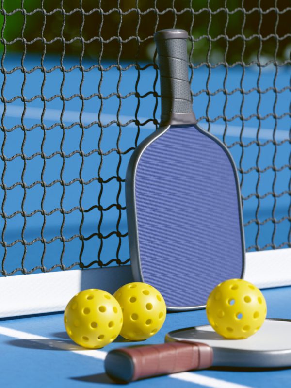 A pickleball paddle and balls